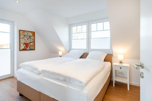 Postel nebo postele na pokoji v ubytování Apartment am Deich 04