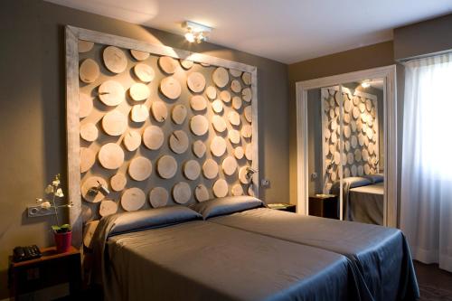 Postel nebo postele na pokoji v ubytování Hotel Salbatoreh