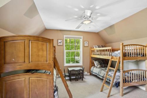a room with two bunk beds and a bed at Red Bear Run in Beech Mountain