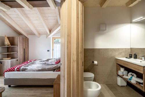 En eller flere senge i et værelse på Prà Lisandro