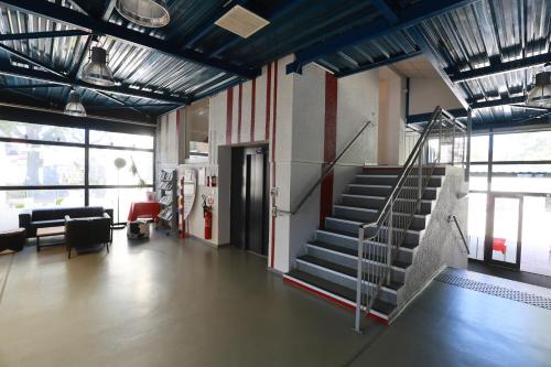 a lobby with a staircase in a building at Auberge de Jeunesse de Mulhouse in Mulhouse