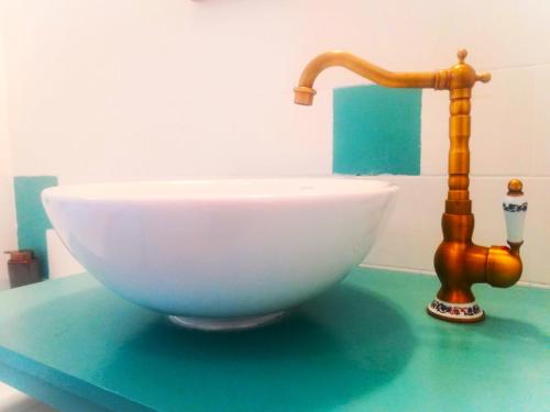 a sink and a faucet on top of a counter at Mályva-ház Verőce in Verőce
