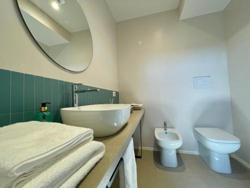 a bathroom with a white sink and a toilet at Residenza Margherita in Montefiascone
