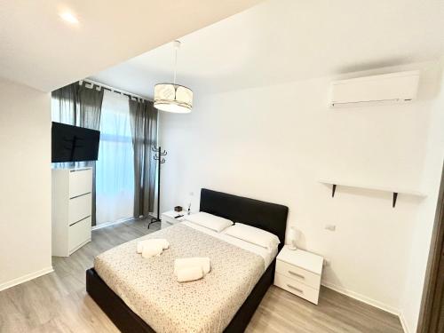 a bedroom with a bed with two white pillows at Un Letto Ideale EUR in Rome