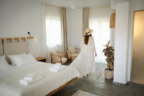 Ένα ή περισσότερα κρεβάτια σε δωμάτιο στο Villa Vivari Suites