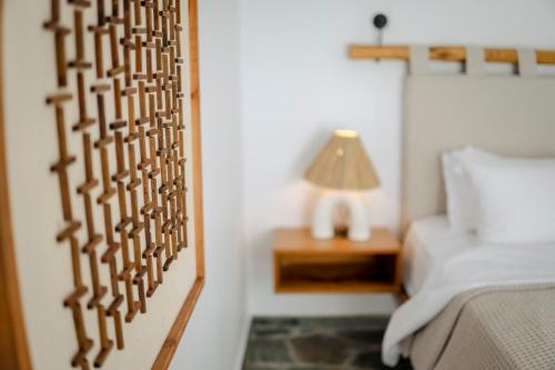 Ένα ή περισσότερα κρεβάτια σε δωμάτιο στο Villa Vivari Suites