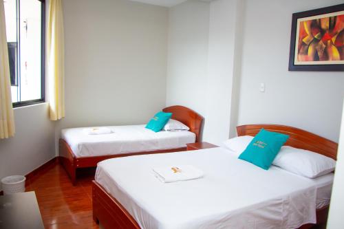 Postel nebo postele na pokoji v ubytování Hotel Sueño Tropical