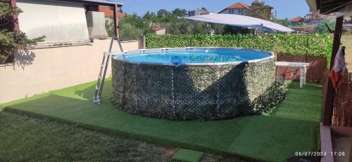 a swimming pool in a yard with a fence at Villa Mary in Makrýgialos