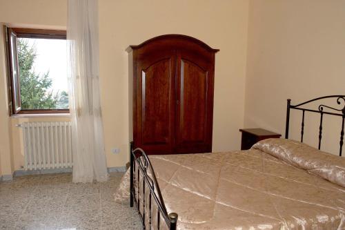 Ένα ή περισσότερα κρεβάτια σε δωμάτιο στο La Staccionata