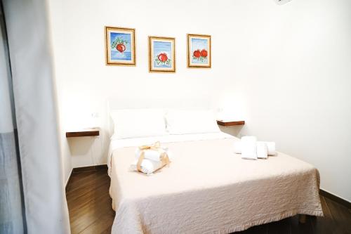 Letto o letti in una camera di B&B La Melagrana