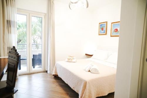 Letto o letti in una camera di B&B La Melagrana
