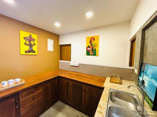 a kitchen with a sink and a counter top at Havelock City Hostel, Colombo in Colombo