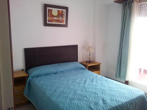 Ένα ή περισσότερα κρεβάτια σε δωμάτιο στο Apartamento Miramar II