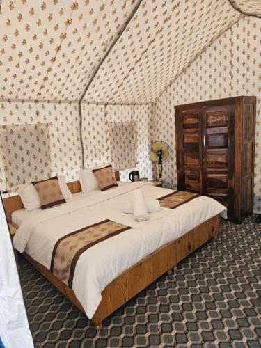 Voodi või voodid majutusasutuse The Alpinist Glamping Resort toas