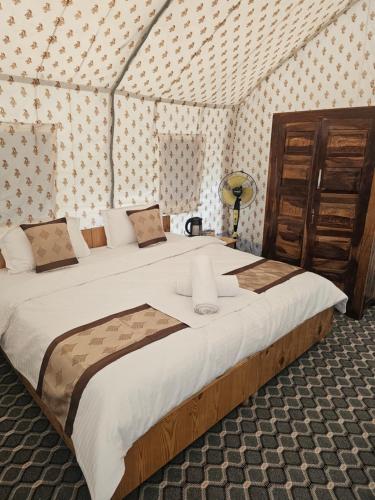 Voodi või voodid majutusasutuse The Alpinist Glamping Resort toas
