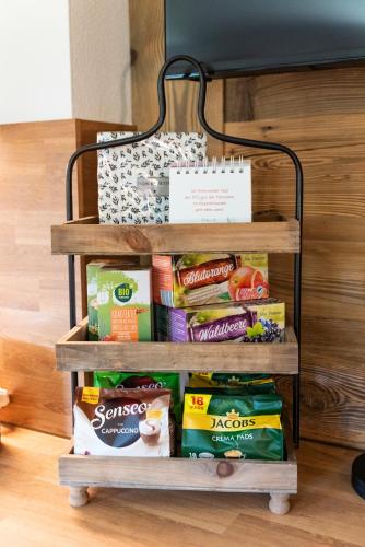 a rack filled with different types of food at Appartement Auszeit in Alpbach