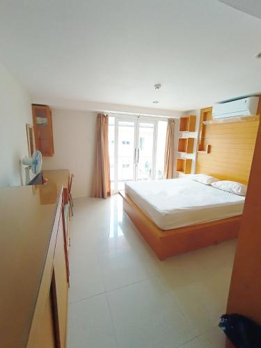 Ένα ή περισσότερα κρεβάτια σε δωμάτιο στο Harris Hotel & Residences Kuta