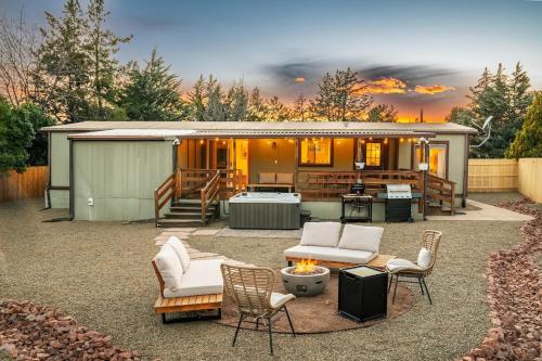 a backyard with a building with a fire pit at Stunning Javelina Hideaway with Hot Tub and King Bed in Sedona