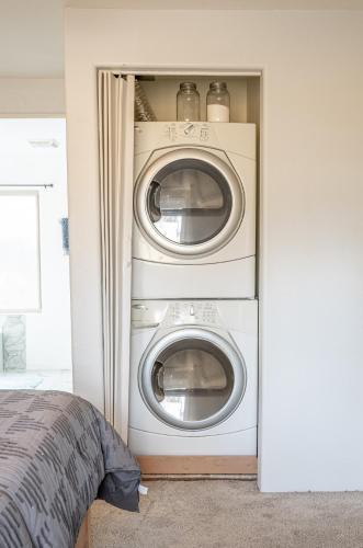 a bedroom with two washing machines in a closet at Stunning Javelina Hideaway with Hot Tub and King Bed in Sedona