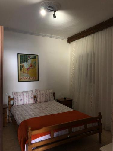 Postel nebo postele na pokoji v ubytování Roula Apartment