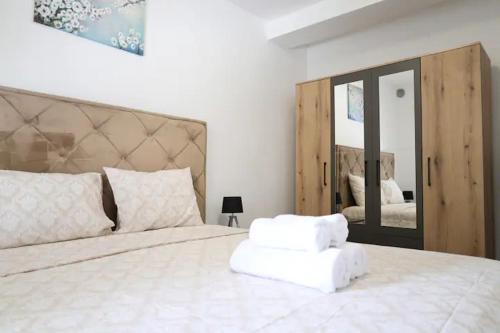 En eller flere senger på et rom på Apartments R&M