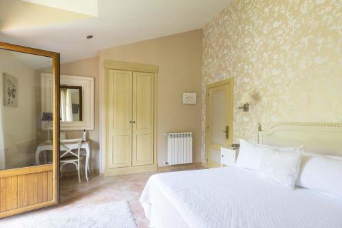 Hotel Rural Arpa de Hierbaにあるベッド