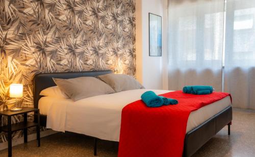 a bedroom with a bed with two towels on it at Bragadin75 In Vaticano in Rome