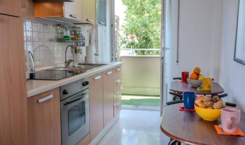 a kitchen with a sink and a table with fruit on it at Bragadin75 In Vaticano in Rome