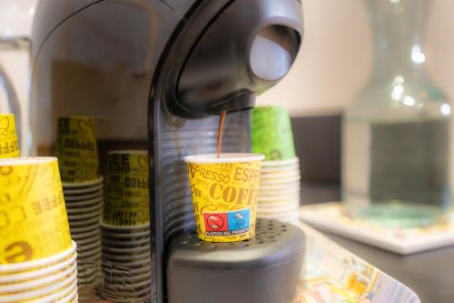 a coffee cup is being poured into a coffeeimp at Bragadin75 In Vaticano in Rome