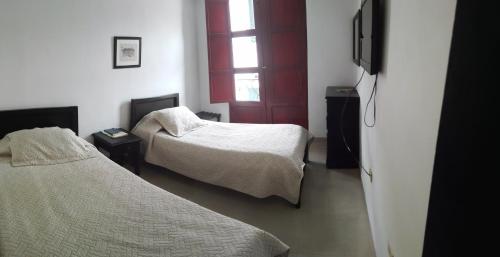 Hotel Popayan Plazaにあるベッド