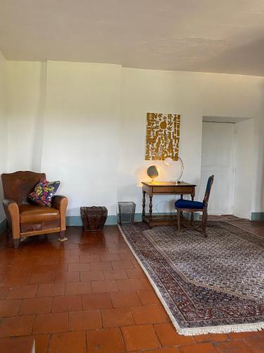 a living room with two chairs and a table at Chateau de Montcuquet in Lautrec