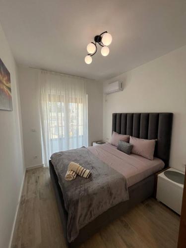 Ένα ή περισσότερα κρεβάτια σε δωμάτιο στο Frekuenca Apartments