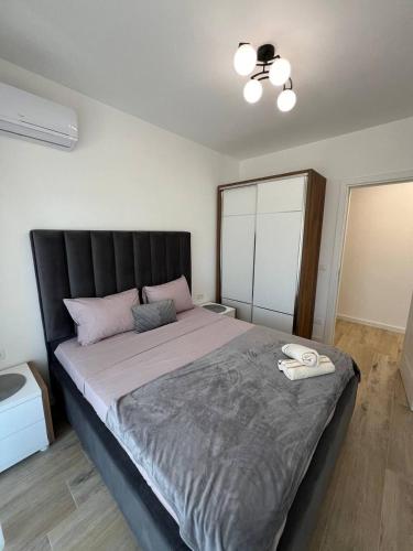 Ένα ή περισσότερα κρεβάτια σε δωμάτιο στο Frekuenca Apartments