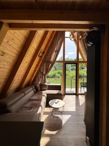 a living room with a couch and a table at Oasis of peace in Šavnik