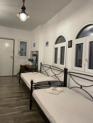 Ένα ή περισσότερα κρεβάτια σε δωμάτιο στο Lagonisi MAGIC HOME RELAXATION