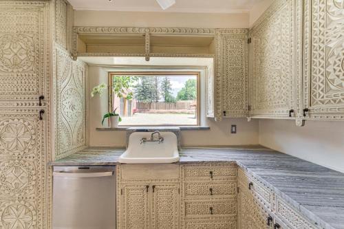 a kitchen with a sink and a window at Mid-Century Modern Taos Home with Hot Tub and Fire Pit in Taos