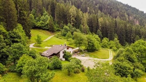 an aerial view of a house in the middle of a forest at Luxury Chalet Dolomiti-Campiglio-Trentino in Porte di Rendena