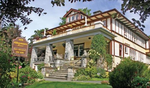 a large house with a sign in front of it at Abbeymoore Manor in Victoria