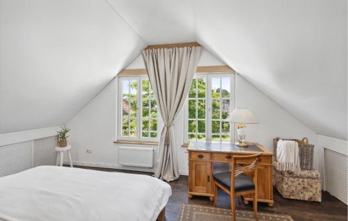 a bedroom with a bed and a desk and a window at Cozy Home In Warendorf With Wifi in Warendorf