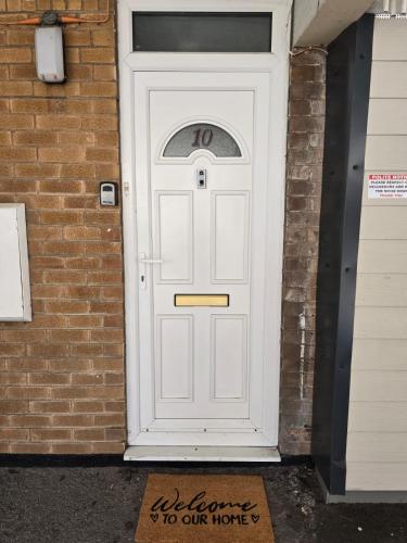 a white door with the number on it at Cosy Home City Centre with free parking in Nottingham