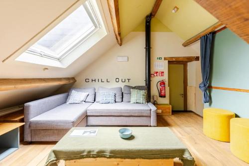 a living room with a couch and a window at Le repos Ardenne (Fays-Famenne) in Wellin
