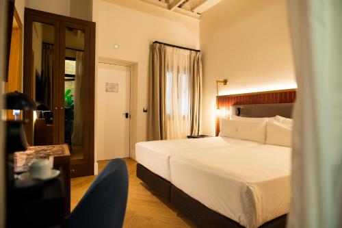 Katil atau katil-katil dalam bilik di Legado Magdalena Hotel