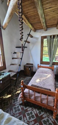 Ένα ή περισσότερα κρεβάτια σε δωμάτιο στο Hunab Ku Hostel