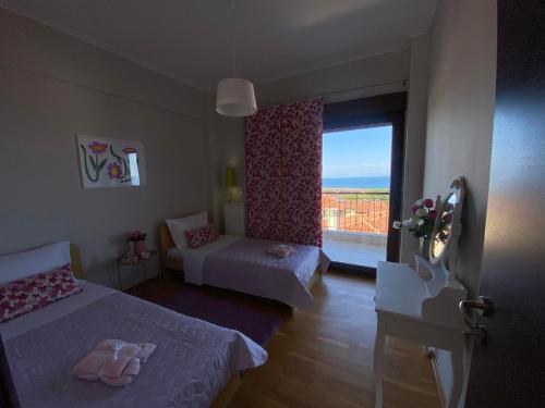 Ένα ή περισσότερα κρεβάτια σε δωμάτιο στο Olympea Suite