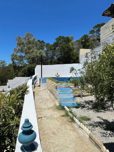 a pathway leading to a house with blue water at Casa Tanger in Tangier
