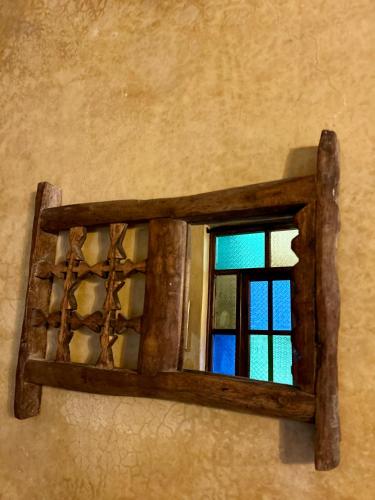 a wooden window on the side of a wall at Riad Dama & Spa in Marrakech