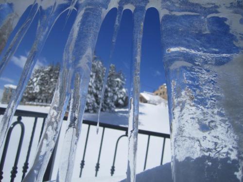 a fork with icicles on it in the snow at Cedars Palace in Al Arz