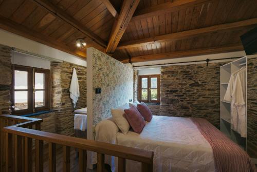 Кровать или кровати в номере casa Robaleira
