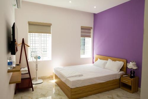 Ένα ή περισσότερα κρεβάτια σε δωμάτιο στο Violet Villa Hue