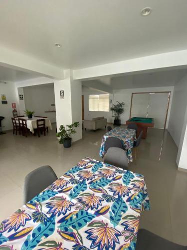 a room with a table and chairs in a room at Killamoon House Paracas in Paracas